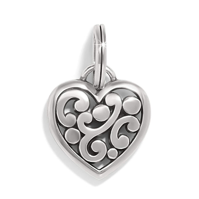Brighton heart charm with silver-tone scroll and dot openwork design and split ring on a white background