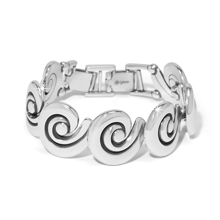 Brighton bracelet with silver-plated swirl-shaped links and fold-over clasp closure on a white background