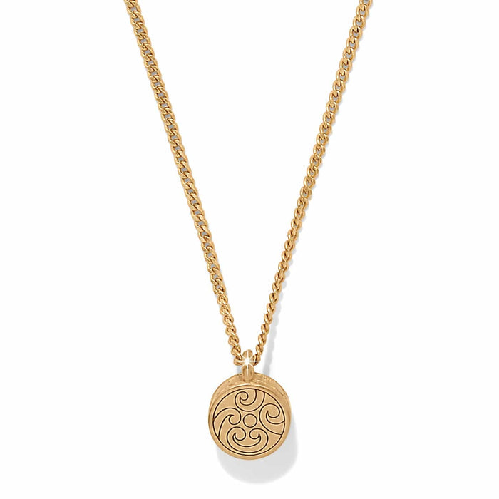 Brighton pendant necklace with gold-plated round medallion featuring swirl scroll design on curb chain on a white background