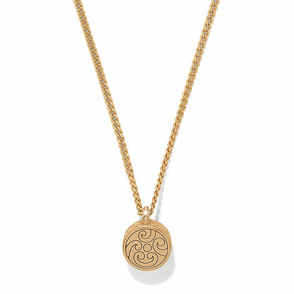 Brighton pendant necklace with gold-plated round medallion featuring swirl scroll design on curb chain on a white background