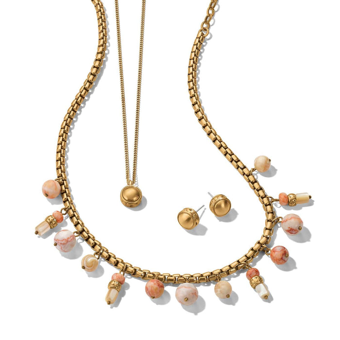 Brighton gold-plated layered necklace and stud earrings set with pink and cream marbled beads on a white background