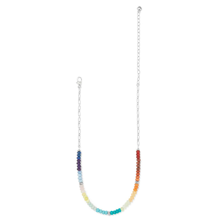 Brighton necklace with rainbow gradient beads and silver-plated chain and clasp on a white background