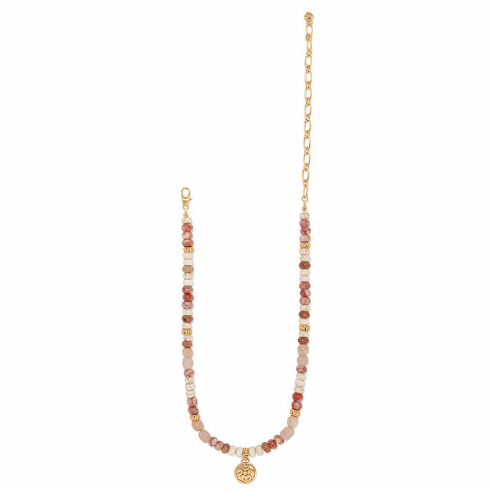 Brighton beaded necklace with web jasper, white howlite, picture jasper beads, gold-plated chain and medallion charm on a white background