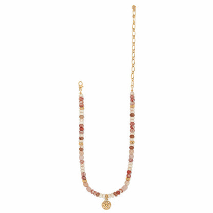 Brighton beaded necklace with web jasper, white howlite, picture jasper beads, gold-plated chain and medallion charm on a white background
