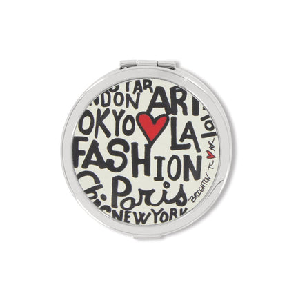 Brighton round compact mirror with fashion city graphic print featuring black text and red heart on a white background