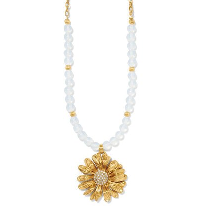 Brighton beaded necklace with white beads and gold-plated daisy pendant featuring crystal center on a white background
