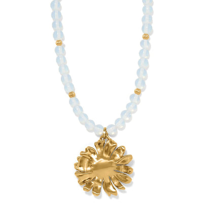 Brighton pendant necklace with opalescent crystal beads and gold-plated floral medallion on a white background