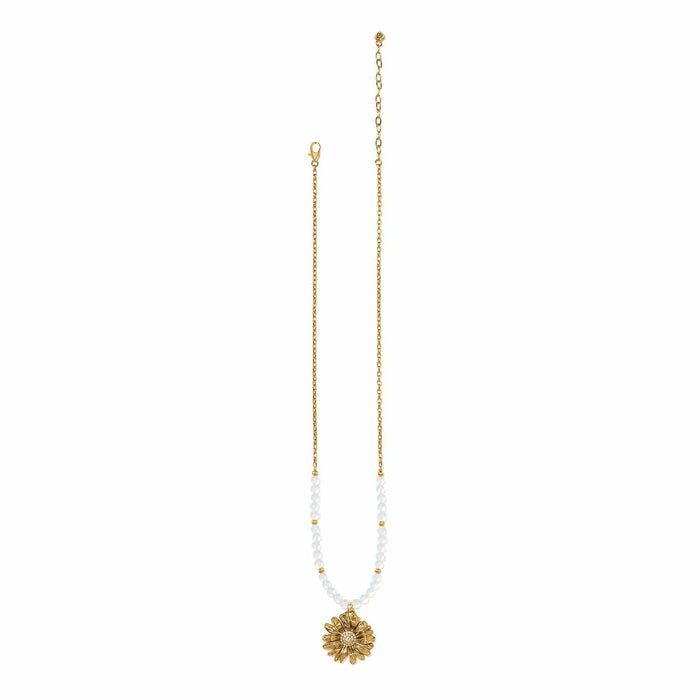 Brighton gold-plated necklace with white beads and crystal-accented daisy flower pendant on a white background