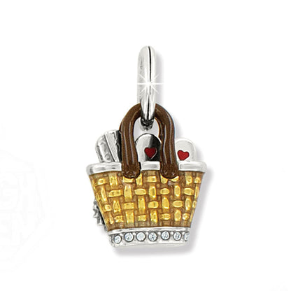 Brighton picnic basket charm with yellow enamel weave, brown handles, red heart accents, and crystals on a white background