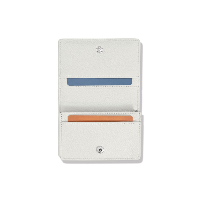 Brighton white pebbled leather bifold card wallet shown open with card slots and snap closure on a white background