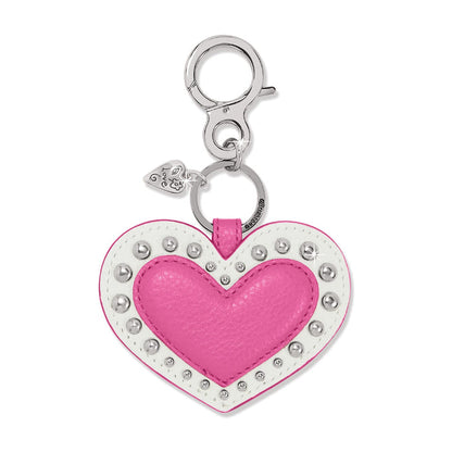 Brighton heart bag charm in pink and white leather with silver-tone studs and clasp on a white background