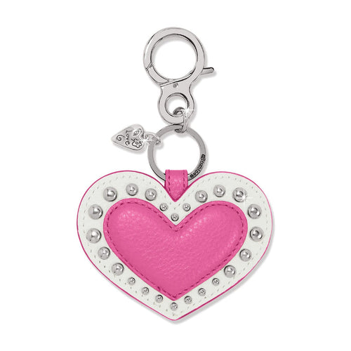 Brighton heart bag charm in pink and white leather with silver-tone studs and clasp on a white background