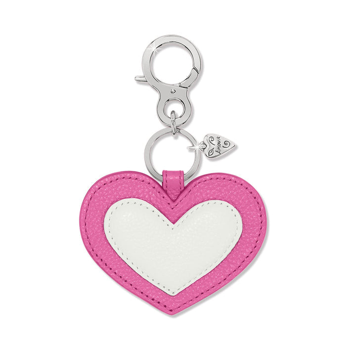 Brighton heart-shaped leather bag charm in pink and white with silver-tone clasp and heart accent on a white background