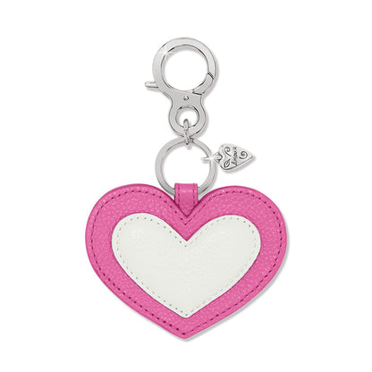 Brighton heart-shaped leather bag charm in pink and white with silver-tone clasp and heart accent on a white background