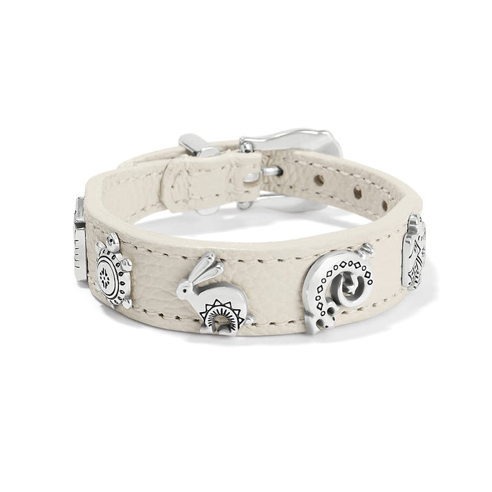 Brighton cream leather bracelet with silver-plated animal charms and buckle closure on a white background