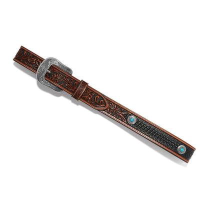 Brighton tooled leather belt with floral scroll design, basketweave texture, turquoise howlite conchos, and engraved silver-tone buckle on a white background