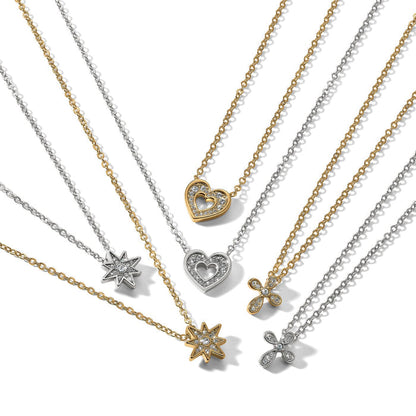 Brighton pendant necklaces with silver and gold-plated chains featuring crystal heart, star, and cross pendants on a white background