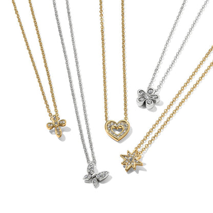 Brighton pendant necklaces with gold and silver chains featuring cross, butterfly, heart, flower, and star crystal pendants on a white background