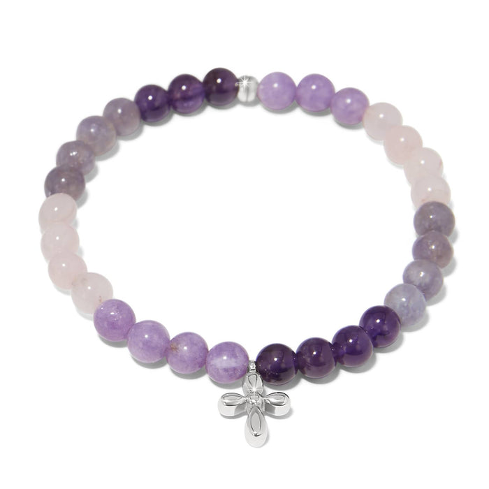 Brighton beaded bracelet with purple amethyst, lavender, and rose quartz beads and silver-plated cross charm on a white background