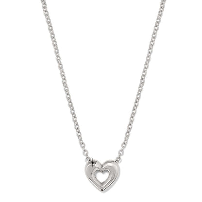 Brighton pendant necklace with silver-plated heart featuring cutout heart center on a delicate chain on a white background
