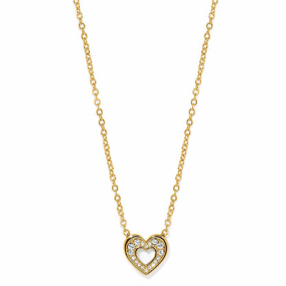 Brighton pendant necklace with gold-plated heart outlined in crystals and cutout center on a white background
