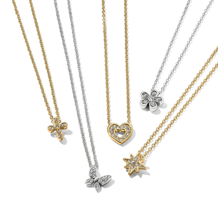 Brighton pendant necklaces with gold and silver-plated chains featuring crystal cross, heart, butterfly, flower, and star pendants on a white background