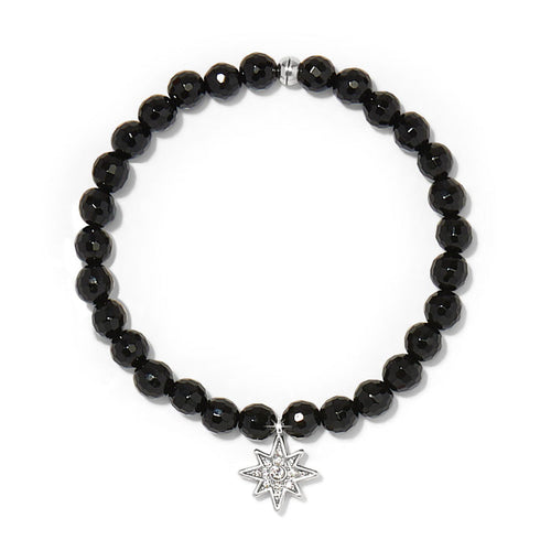 Brighton beaded bracelet with faceted black beads and silver-plated crystal star charm on a white background