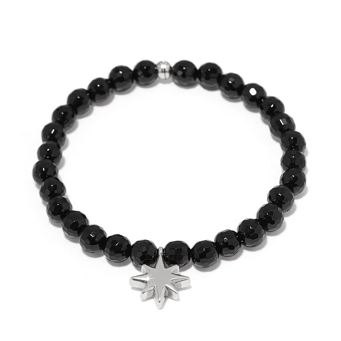Brighton beaded bracelet with faceted black beads and silver-plated star charm on a white background