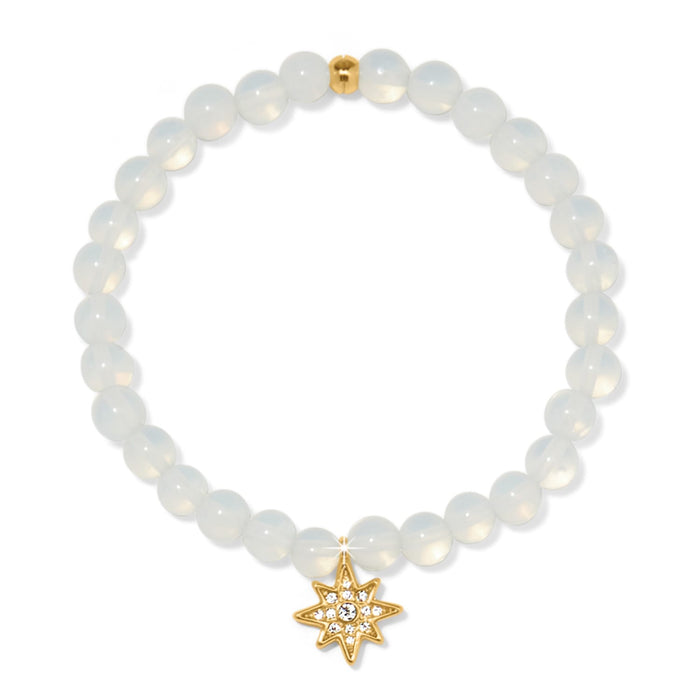 Brighton beaded stretch bracelet with opalescent beads and gold-plated star charm with crystal accents on a white background