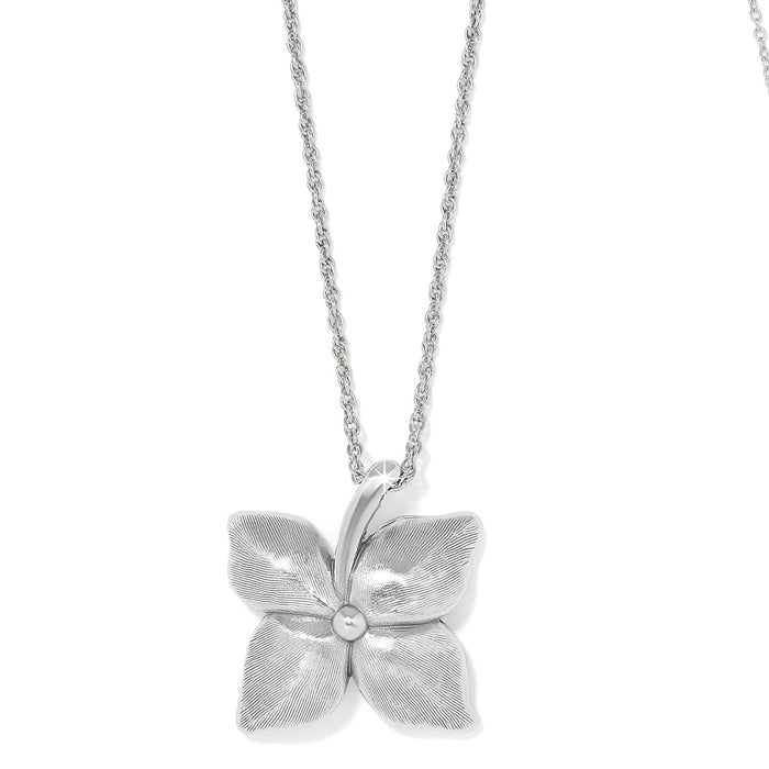 Brighton pendant necklace with silver-plated four-petal flower design and textured petals on delicate chain on a white background