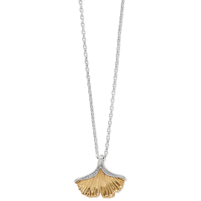 Brighton pendant necklace with gold-tone ginkgo leaf, silver-tone chain, and crystal accents on a white background