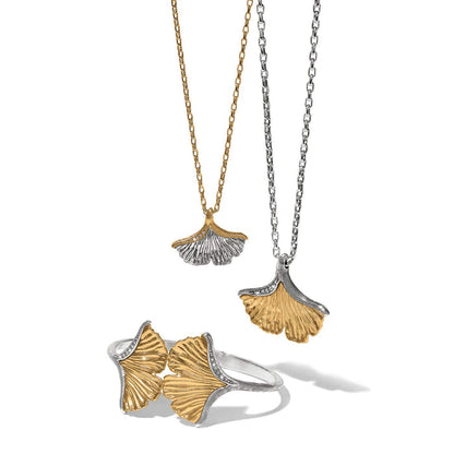 Brighton two-tone ginkgo leaf necklaces and hinged bangle styled with crystal accents on a white background