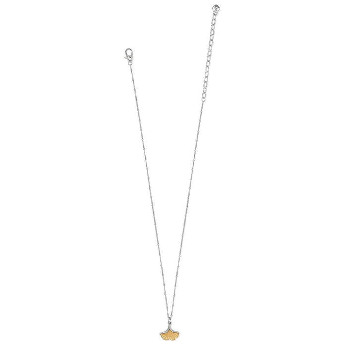 Brighton pendant necklace with two-tone ginkgo leaf charm and silver-tone beaded chain on a white background