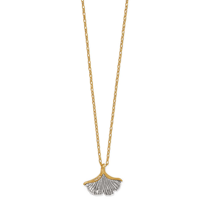 Brighton pendant necklace with two-tone ginkgo leaf charm and crystal accents on gold-tone chain on a white background
