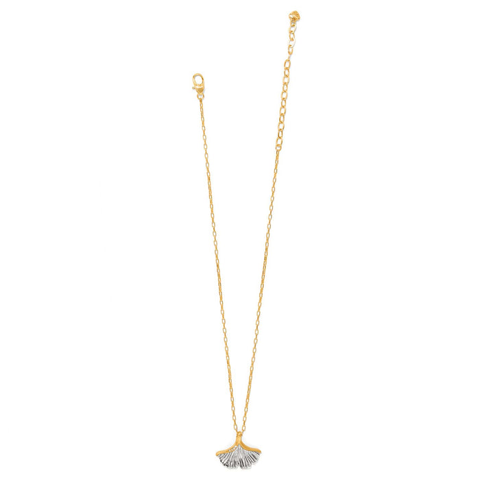Brighton pendant necklace with two-tone ginkgo leaf charm, crystal accents, and gold-tone chain on a white background