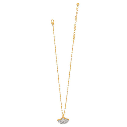 Brighton pendant necklace with two-tone ginkgo leaf charm, crystal accents, and gold-tone chain on a white background