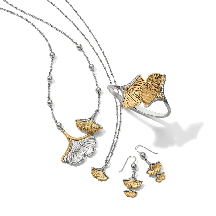 Brighton two-tone ginkgo leaf jewelry set styled with pearl-accented chains and crystal details on a white background