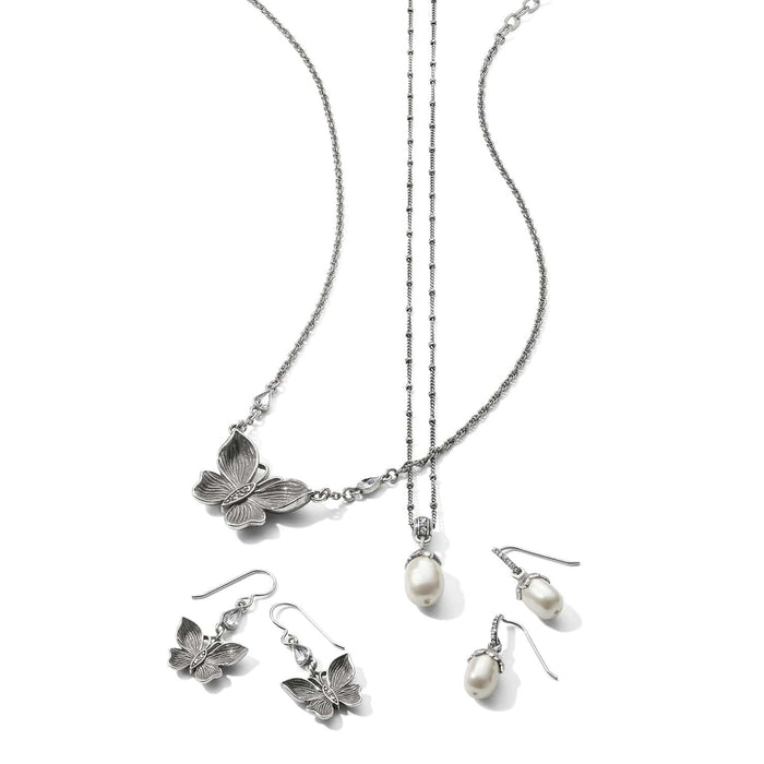 Brighton silver-plated butterfly necklace with pearl pendant necklace and matching butterfly and pearl drop earrings on a white background
