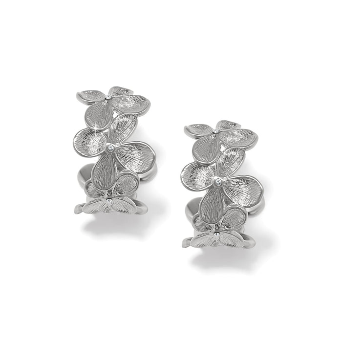 Brighton hoop earrings with silver-plated flower clusters and crystal centers on a white background