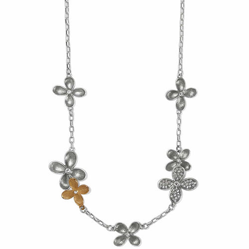 Brighton necklace with silver-tone and gold-tone flower stations featuring crystal accents on a white background