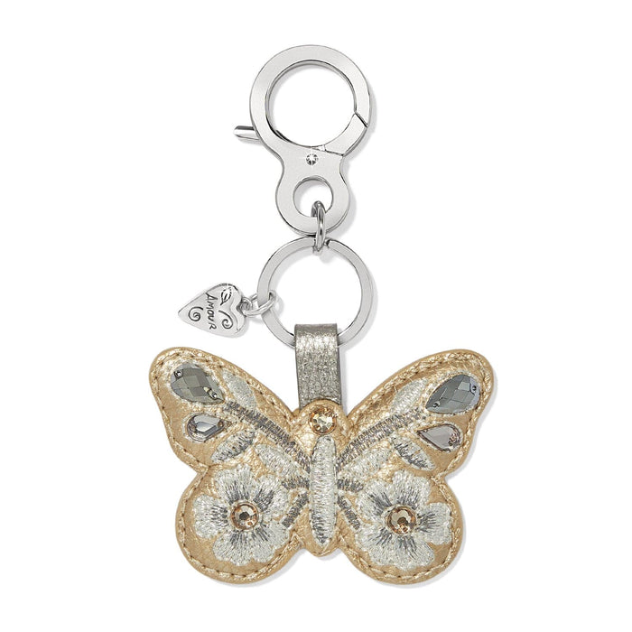 Brighton butterfly bag charm keychain with gold leather, silver embroidery, and crystal accents on a white background