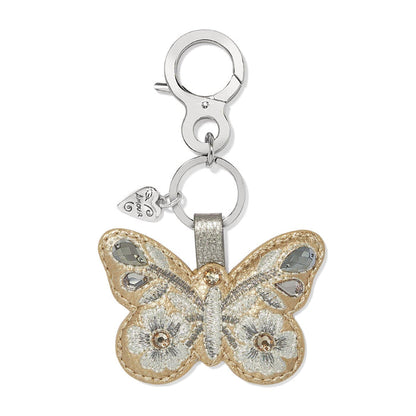 Brighton butterfly bag charm keychain with gold leather, silver embroidery, and crystal accents on a white background