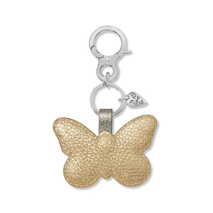 Brighton butterfly bag charm in gold leather with silver-tone clasp and engraved love heart accent on a white background