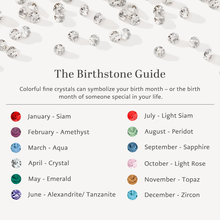 Brighton birthstone guide chart styled with scattered crystals, listing twelve monthly crystal colors from January through December