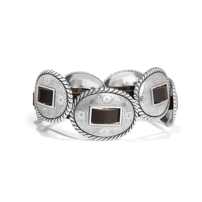 Brighton leather belt with large oval silver-tone engraved concho medallions and rope-edge borders on a white background