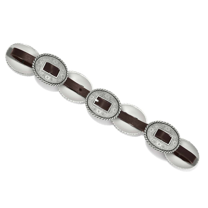 Brighton brown leather belt with three oval silver-tone concho buckles featuring engraved floral scrollwork on a white background