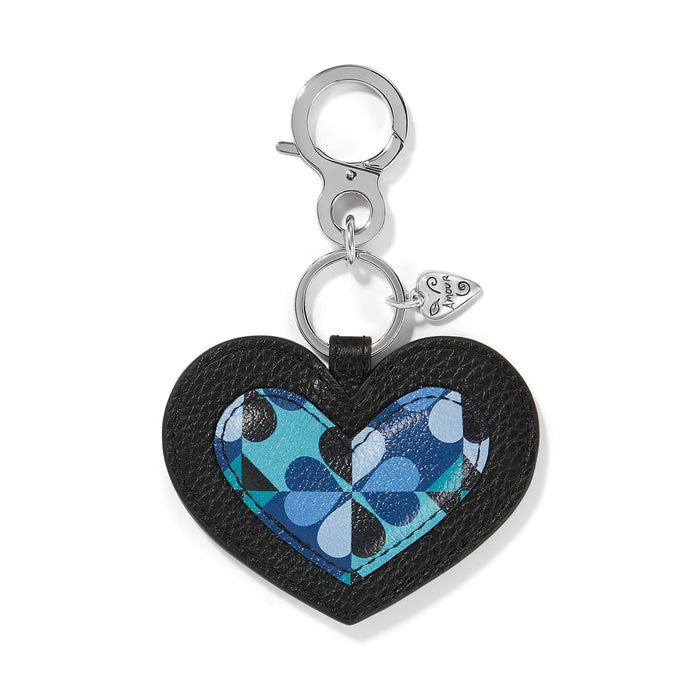 Brighton heart bag charm in black leather with blue geometric print center and silver-tone clasp on a white background