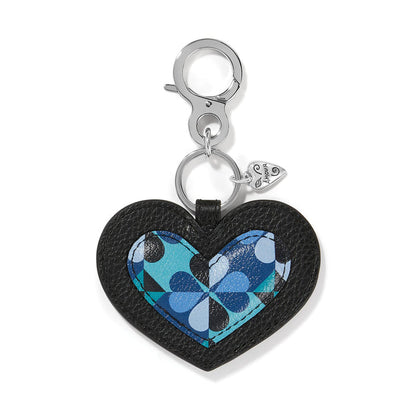 Brighton heart bag charm in black leather with blue geometric print center and silver-tone clasp on a white background