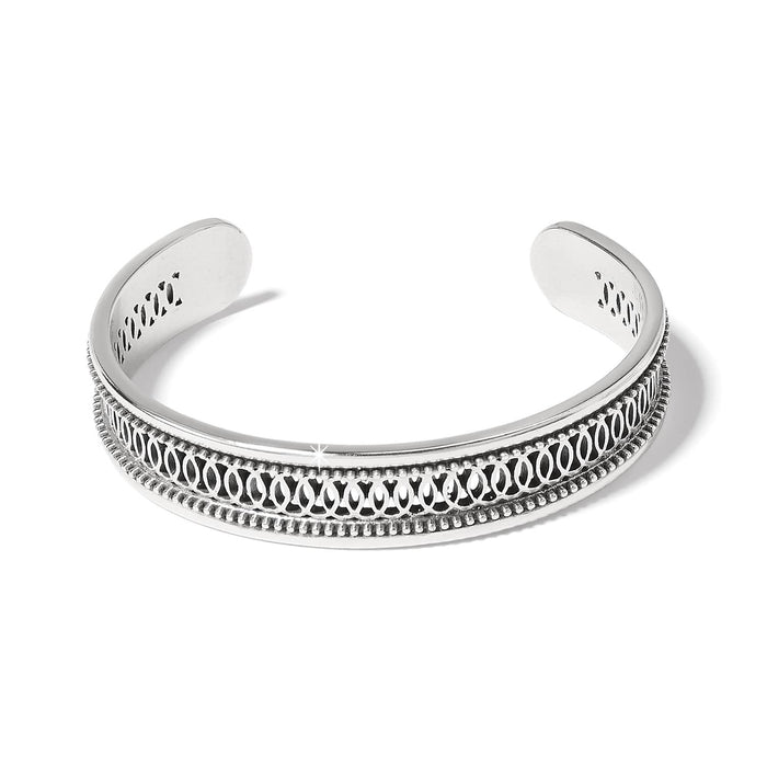 Brighton cuff bracelet with silver-plated finish, openwork scroll pattern, and beaded edges on a white background
