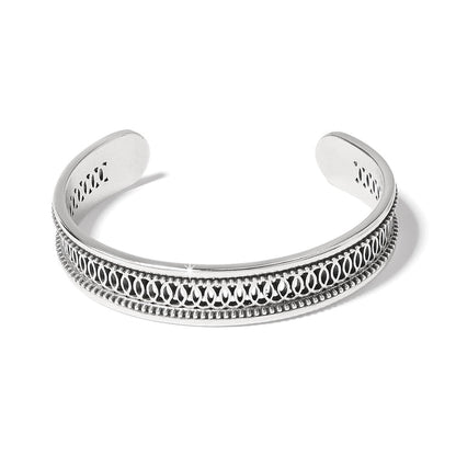 Brighton cuff bracelet with silver-plated finish, openwork scroll pattern, and beaded edges on a white background